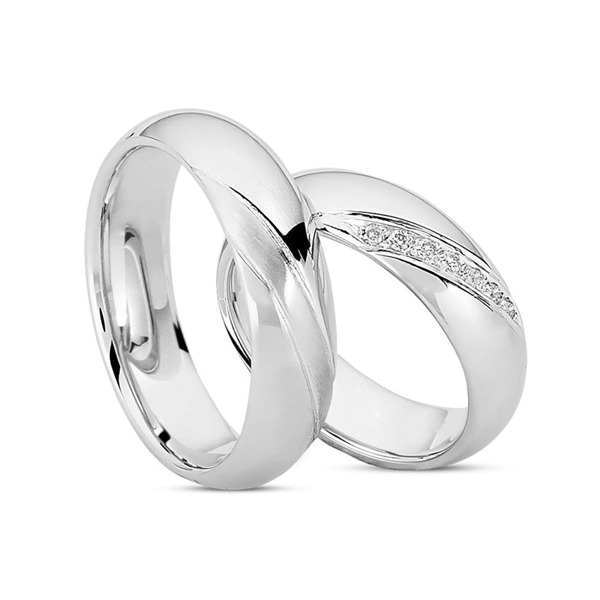 Eksklusivt Nuran vielsesringe i 14 kt hvidguld med blank overflade og 0,09 ct diamanter pavé-indfatning – sæt med herre- og damering.